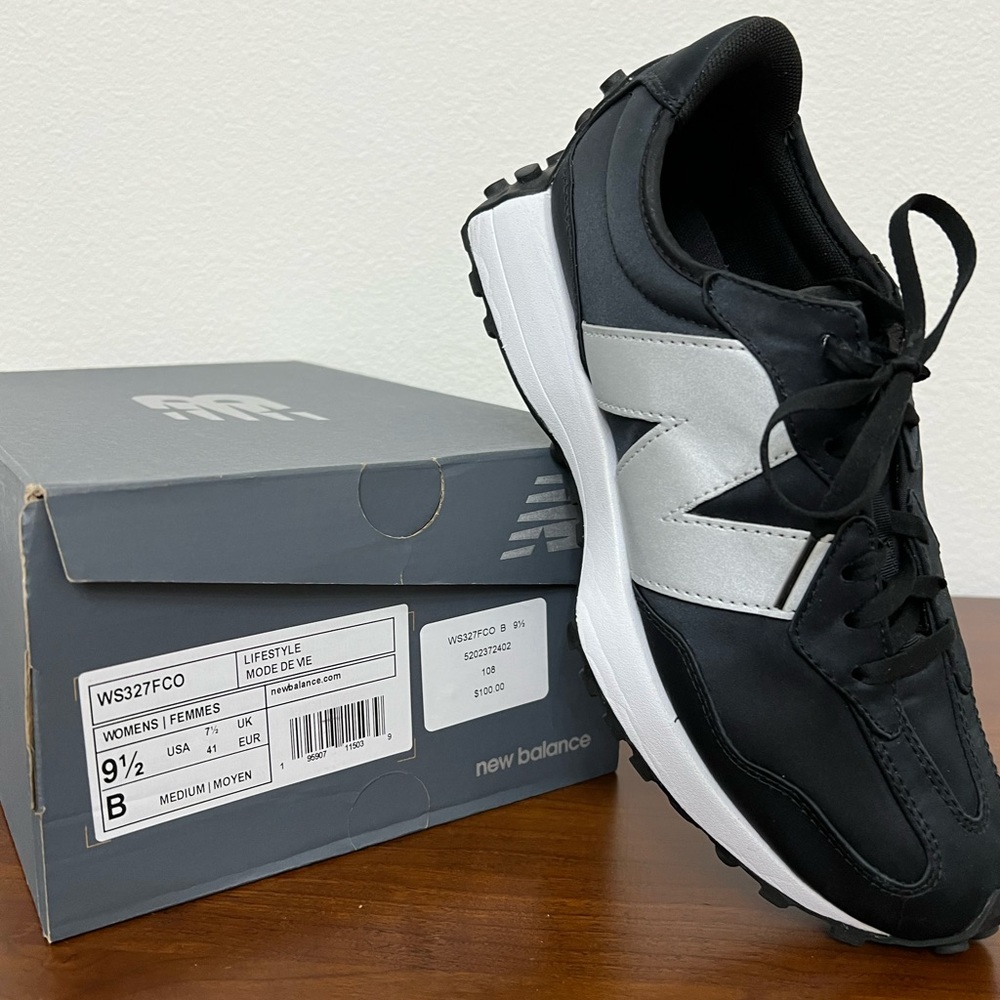 Black 327 New Balance. Slightly worn.